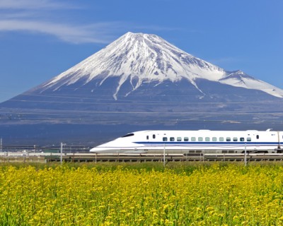 Bullet train in front of mountain